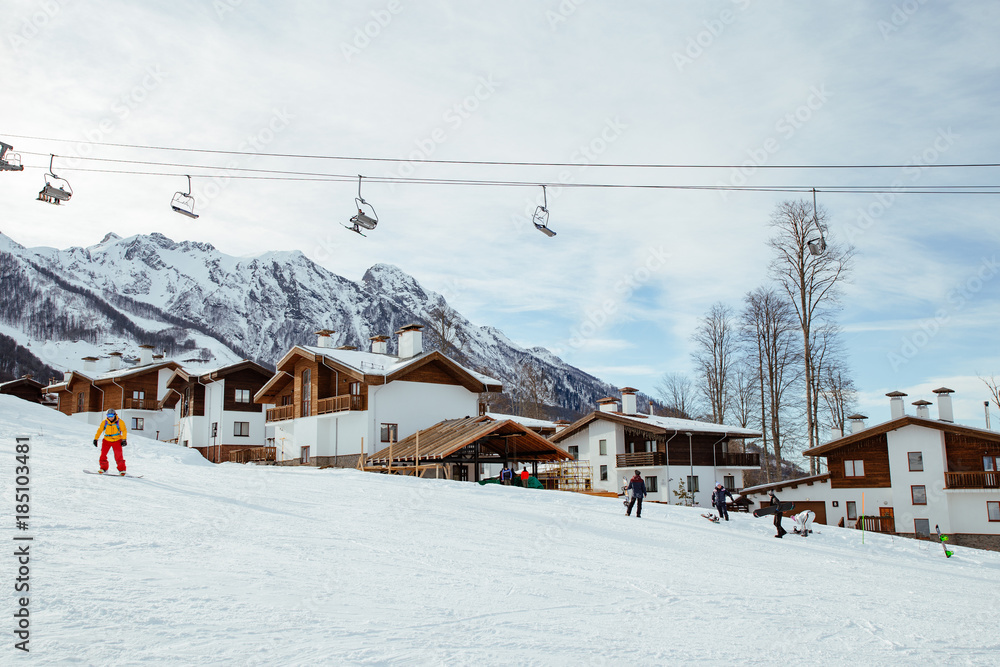   Ski resort, mountain slope. Wooden houses and elevator. Sochi, Rosa Khutor.