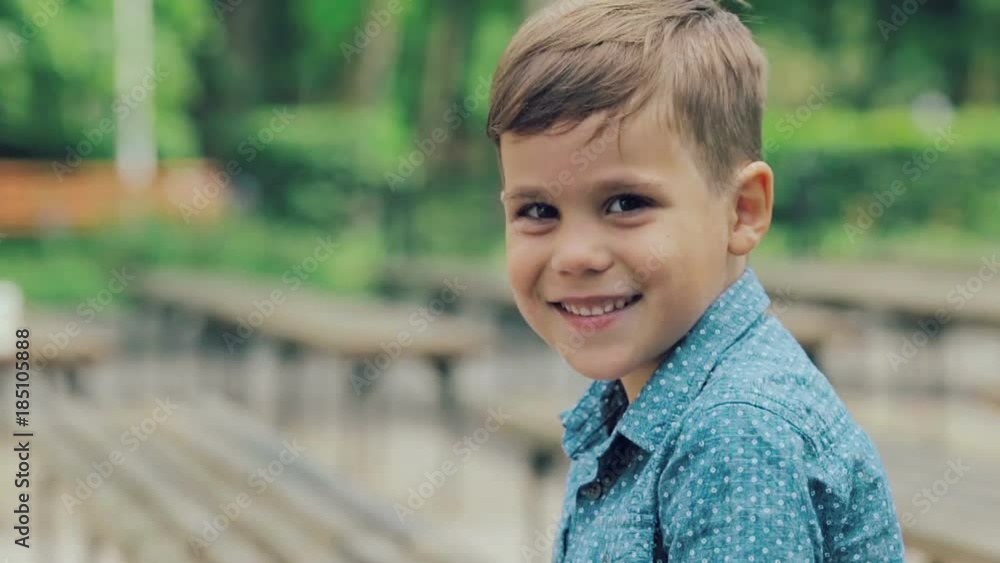 Portrait of little boy who look to the camera and smiling Portrait of little boy who look to the camera and smiling