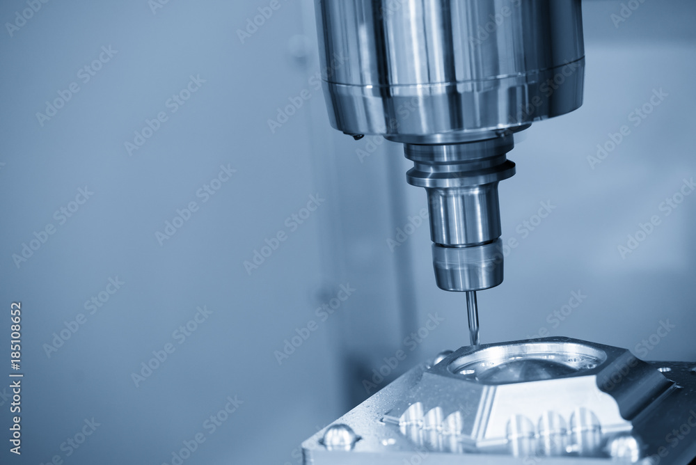 The CNC milling machine cutting the sample part.The end-mill tool cutting the mold part by CNC milling machine. The CNC milling machine cutting the sample part.The end-mill tool cutting the mold part by CNC milling machine.