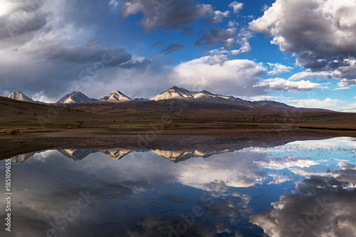 The mountain range Munku-Sardyk is reflected in the lake water