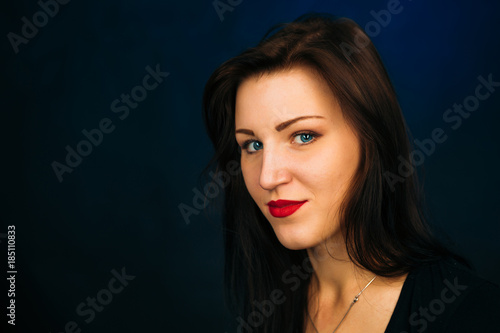 emotional girl smiling on a dark background