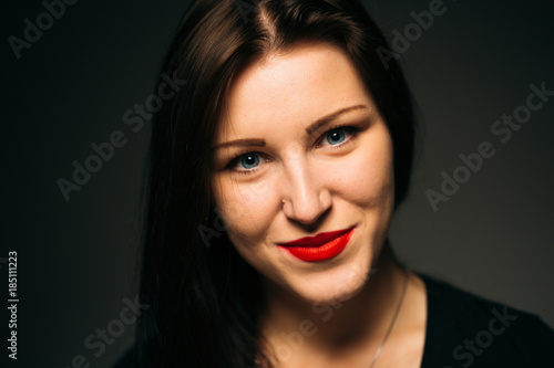 emotional girl smiling on a dark background