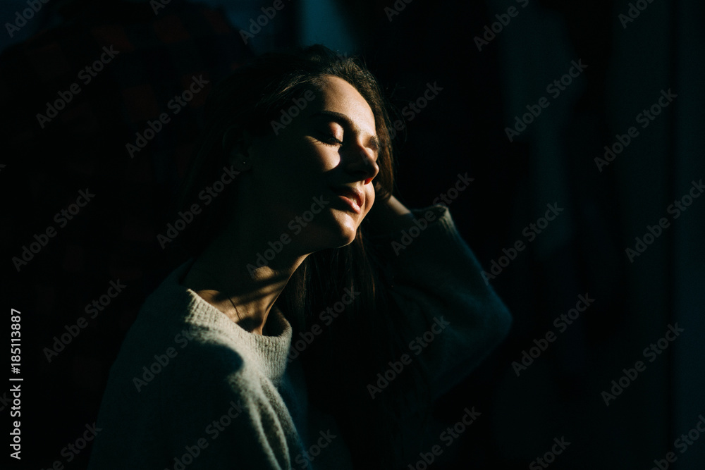 Close up portrait of a beautiful european woman in a black background. High contrast. Close up portrait of a beautiful european woman in a black background. High contrast.