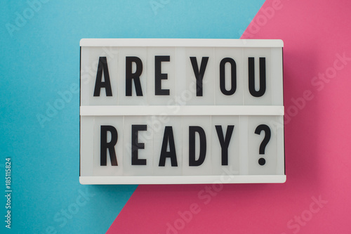 Are you ready - text on a display on blue and pink bright background. photo
