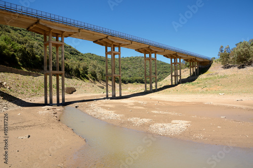 Dry river under a bridge/ effects of climate change