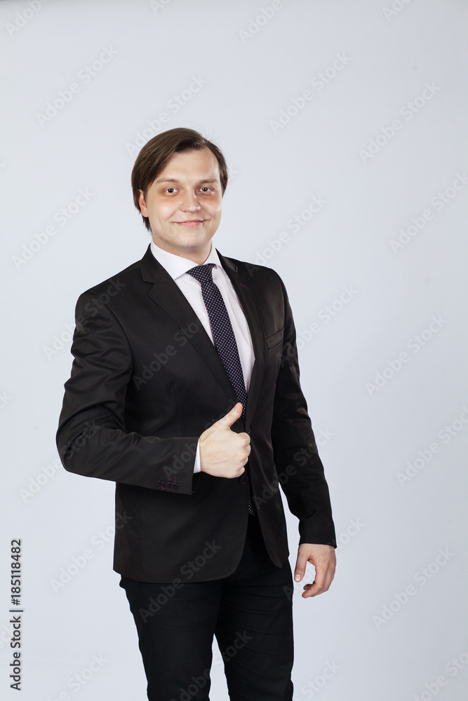 Smiling businessman with thumb up Smiling businessman with thumb up