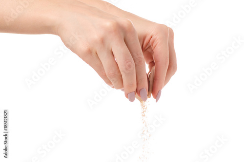 Stick of brown cane sugar female hand