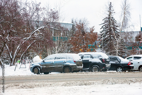 Parked cars covered with snow. Car under the snow