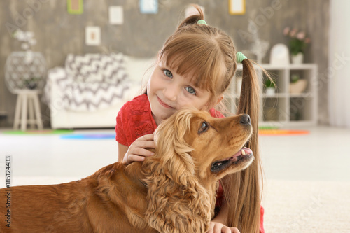 Cute little girl with dog a...