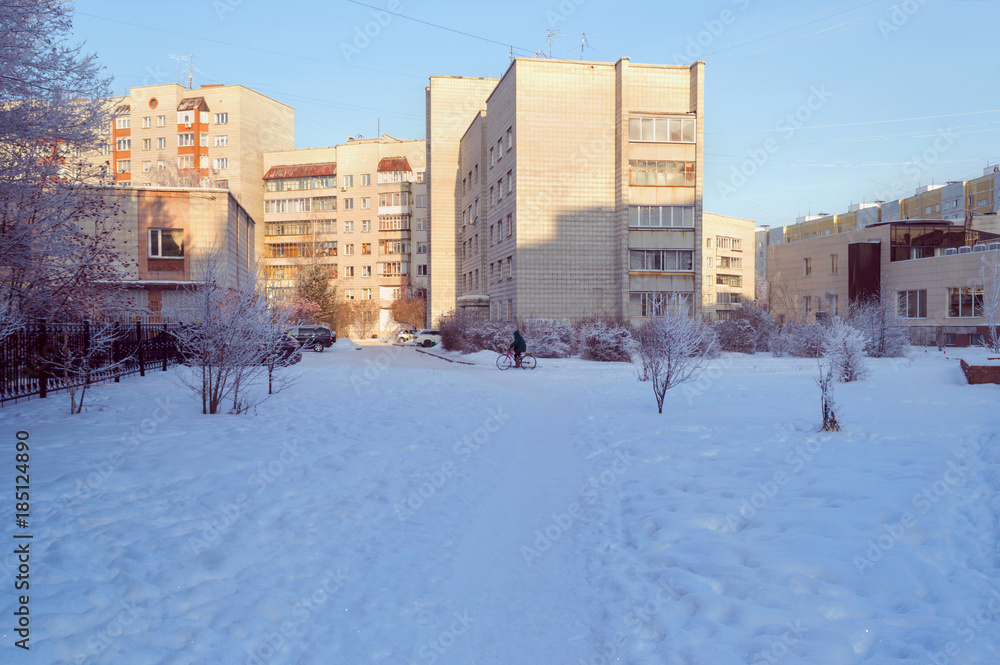 Obraz premium warm sunlight on brick buildings on winter day