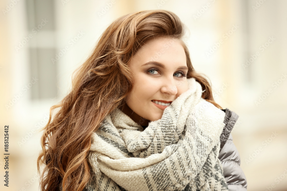 Beautiful smiling woman in puffer jacket outdoors Beautiful smiling woman in puffer jacket outdoors