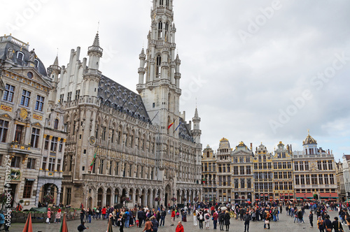 Grand Place in Brussels. Many tourists walk and look at beautiful buildings on the main square in Brussels.