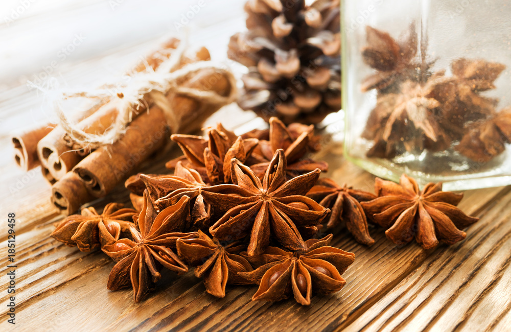 Set of spices on wooden table. Anise stars and cinnamon for flavored mulled wine