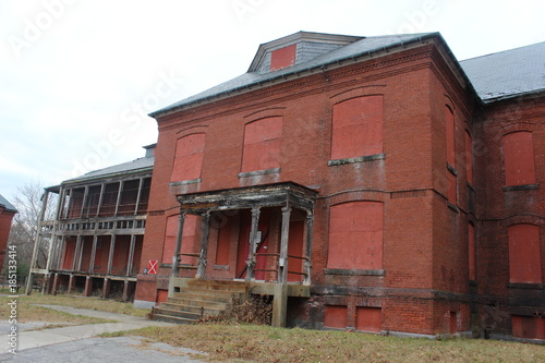 Old abandoned brick hospital building