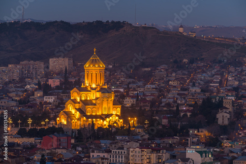 TBILISI, GEORGIA - DEC.12, 2017 : Holy Trinity Cathedral of Tbilisi at dusk view from the hill © phichak