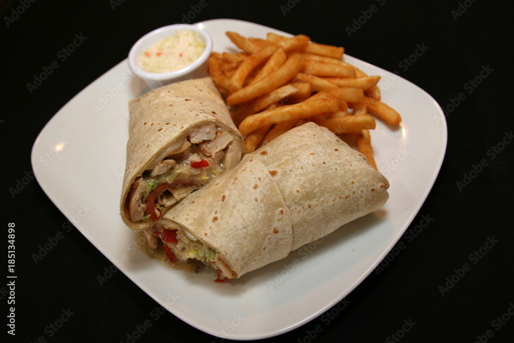 Chicken Wrap and fries. Chicken Wrap and fries.
