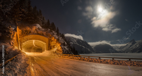 View of illuminated tunnel against sky during winter photo