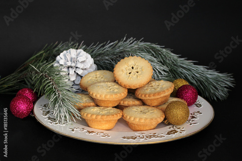 Mince pies on white dish 
