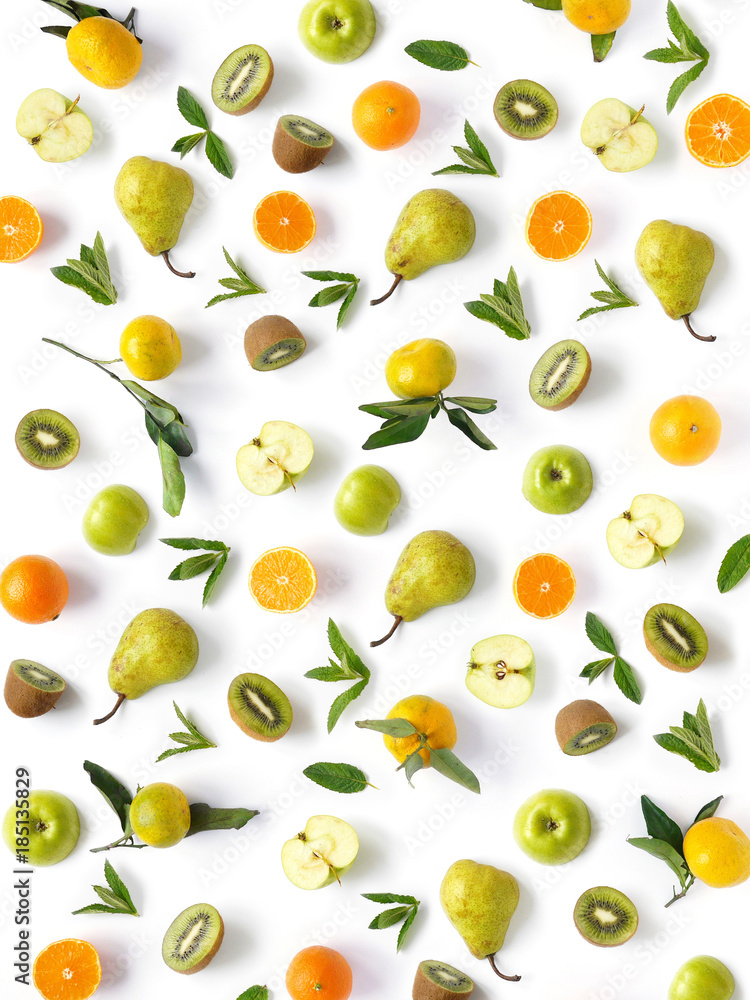 Pattern of  fruits. Abstract food background, top view, flat lay. Composition of pears, apples, mint leaves, kiwi, tangerines and oranges isolated on a white background. Healthy eating.