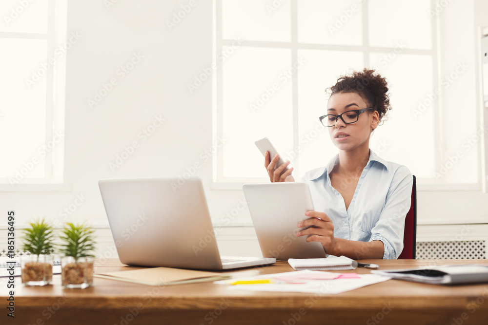 Serious business woman reading document at office desktop Serious business woman reading document at office desktop