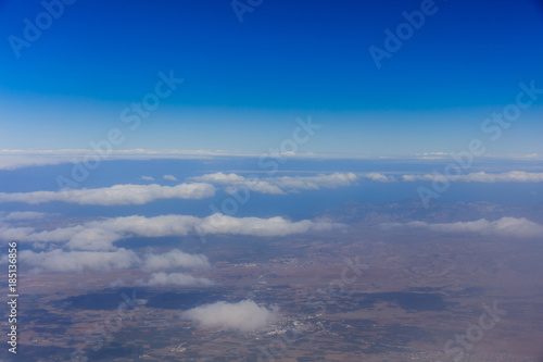 Planet earth. Blue sky  white clouds  land. View from above.