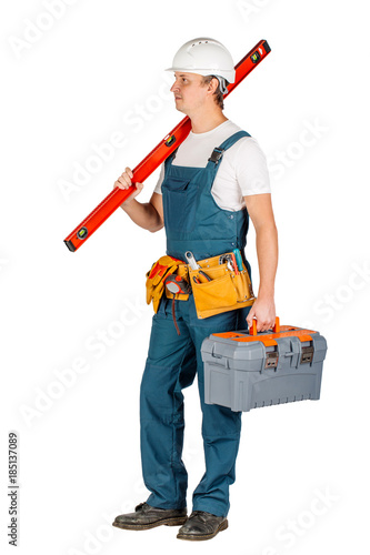 construction worker in a helmet with toolbox