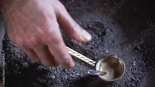 A man make Turkish coffee photo