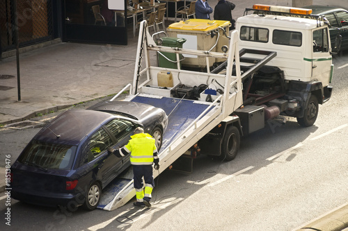 towing  truck car wrecker in city photo