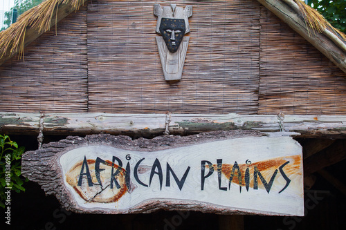African Wooden Face Mask And Sign In Irish Zoo