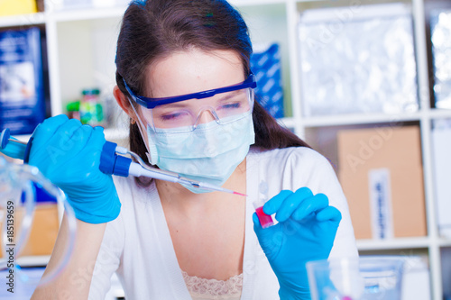 A girl technician in a medical laboratory