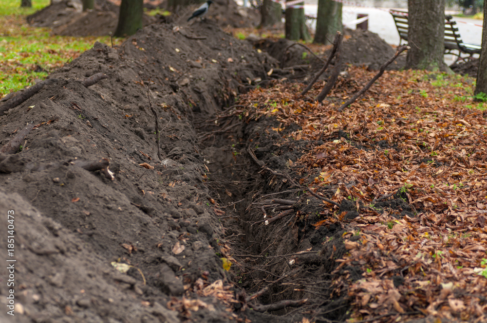 construction of the trench ditch in the Park in autumn construction of the trench ditch in the Park in autumn