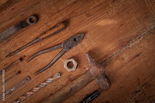 Collection of vintage tools on wooden background