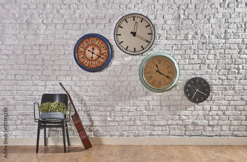 world times on the brick wall concept with guitar style