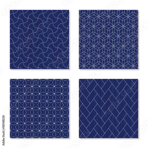 Japanese sashiko ornaments. Set. Asian embroidery motifs. Abstract Seamless patterns. Four simple textures. White stitches on the indigo blue background. For handicraft or decoration.