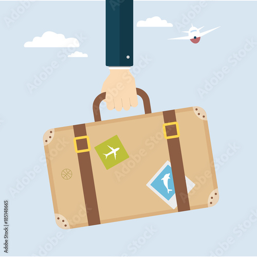 Hand with travel bag.