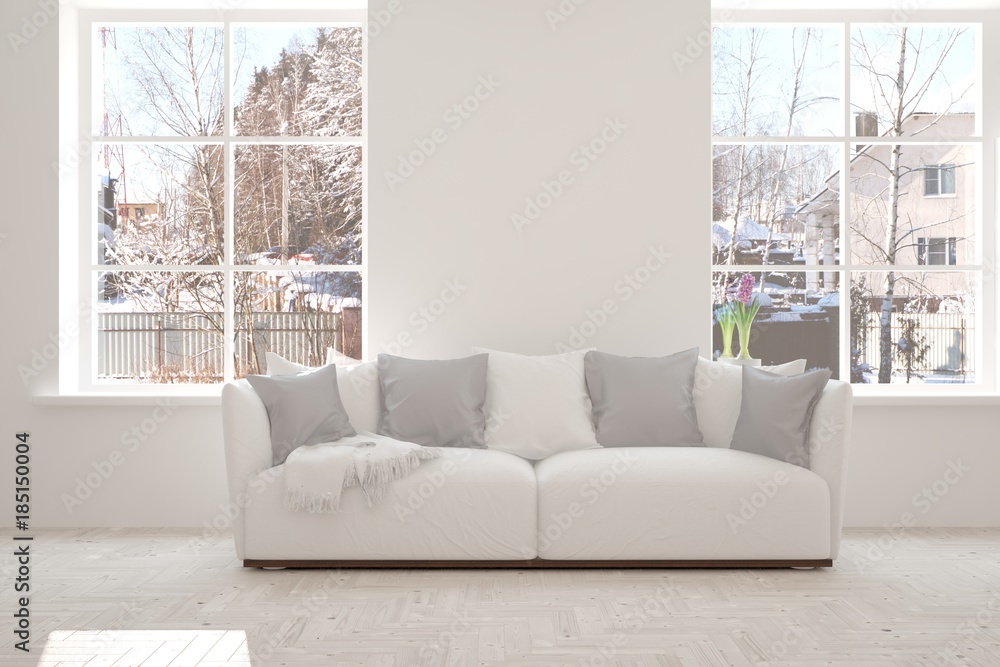 Fototapeta premium White room with sofa and winter landscape in window. Scandinavian interior design. 3D illustration
