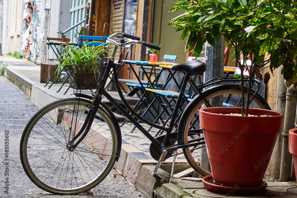 bicycle parked near a street cafe bicycle parked near a street cafe