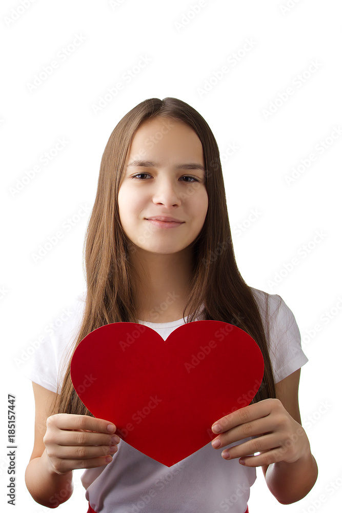 A young girl in a white shirt and red skirt holding a heart A young girl in a white shirt and red skirt holding a heart