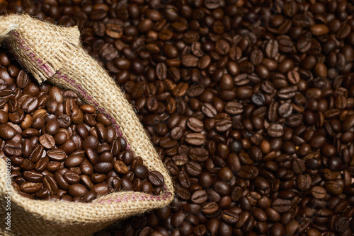 Studio Shot of Burlap Bag with Coffee over coffee beans © Juanma