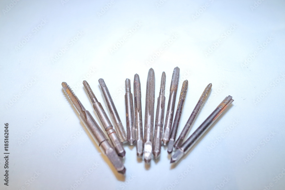 Tool for threading in holes and stilettos on a white background Tool for threading in holes and stilettos on a white background