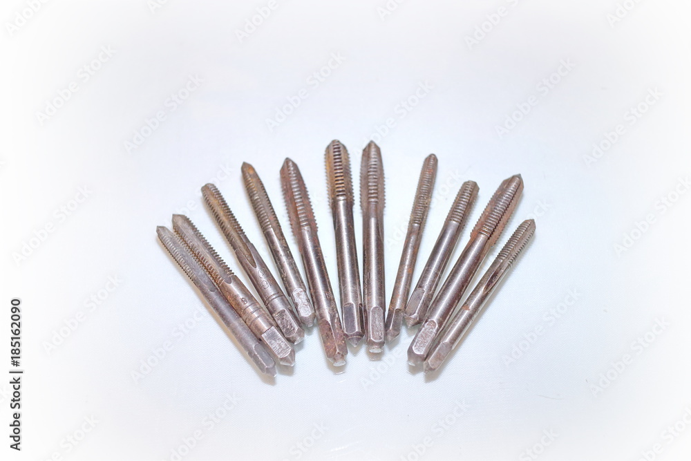 Tool for threading in holes and stilettos on a white background Tool for threading in holes and stilettos on a white background