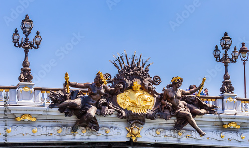 Sculptures on the Alexander III Bridge in Paris, France. View from the water