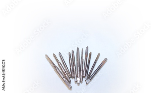 Tool for threading in holes and stilettos on a white background