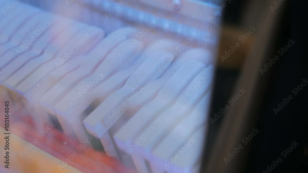 Close up shot of piano hammers playing keys, inside of piano Close up shot of piano hammers playing keys, inside of piano
