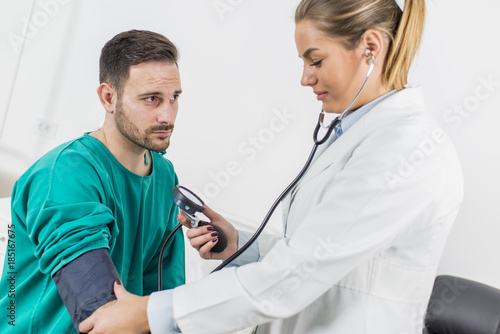 Female doctor checking bloo...