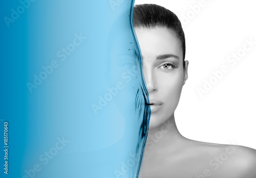 Greyscale beauty portrait of a gorgeous brunette. Moisturizing skin care concept