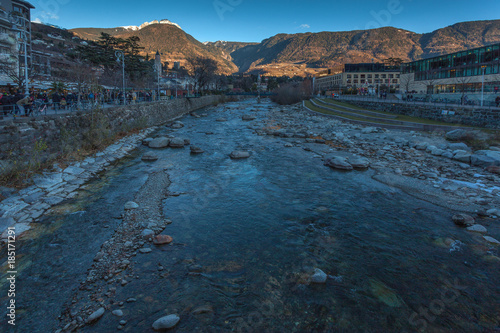 MERANO, ITALY - DECEMBER 09, 2017: view of Passirio River banks with tourists  on the occasion of the Christmas market. These markets are held during the Advent holidays