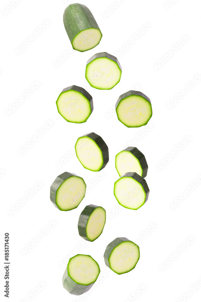 Falling courgettes isolated on white Falling courgettes isolated on white