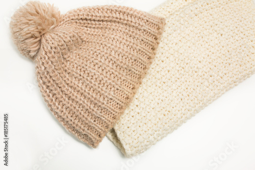 Large-knitted hat and white scarf snud on white background