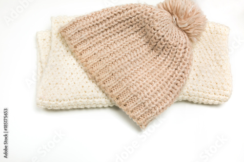 Knitted hat and scarf isolated on white background